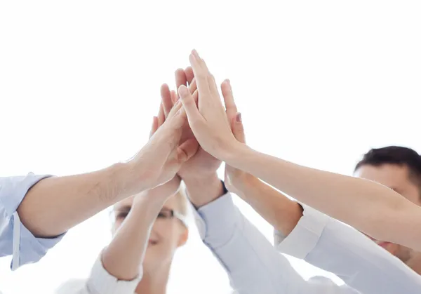 Happy business team giving high five in office — Stock Photo, Image