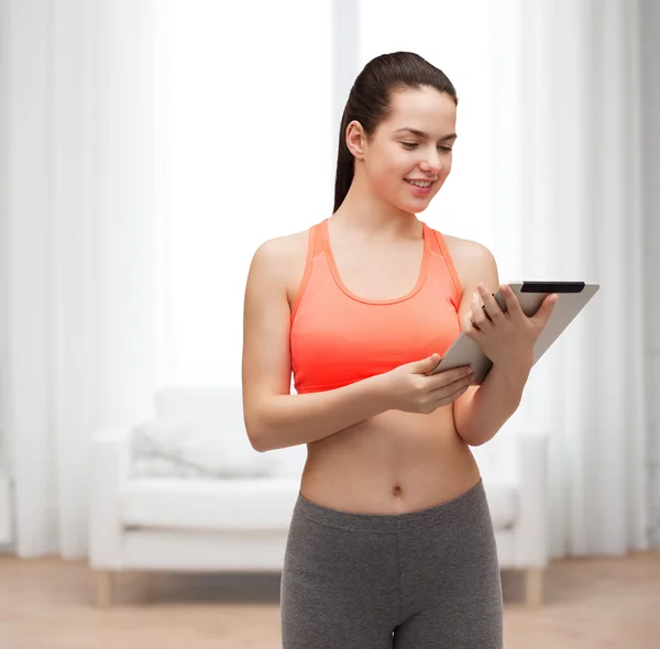 Sporty woman with tablet pc computer — Stock Photo, Image