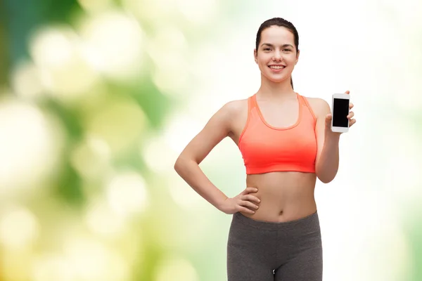 Mujer deportiva con smartphone — Foto de Stock