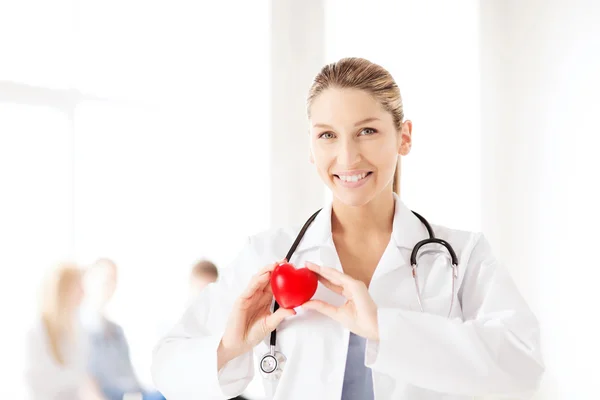 Female doctor with heart — Stock Photo, Image