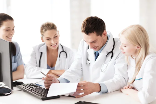 Young team or group of doctors on meeting — Stock Photo, Image