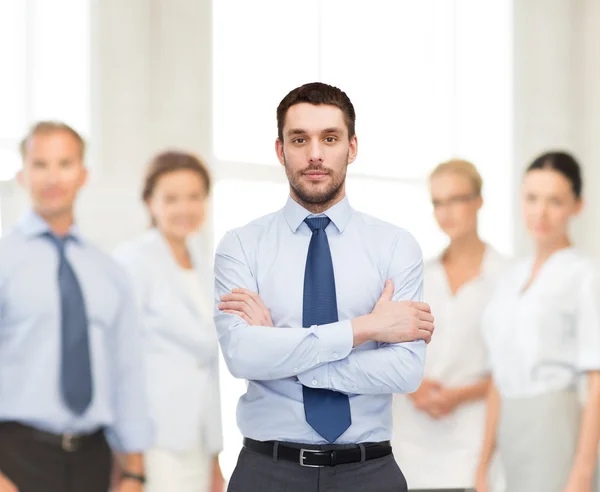 Handsome businessman with crossed arms — Stock Photo, Image