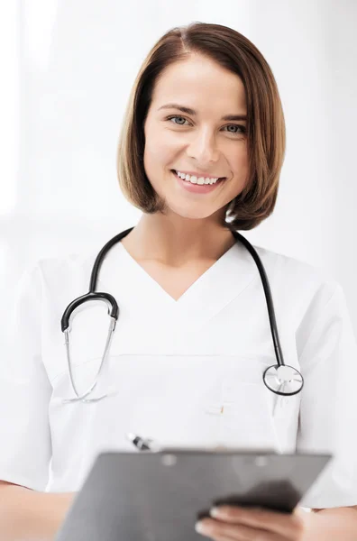 Doctor with stethoscope writing prescription Royalty Free Stock Images