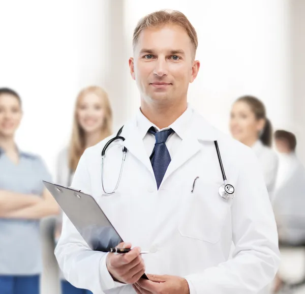 Male doctor with stethoscope and clipboard — Stock Photo, Image