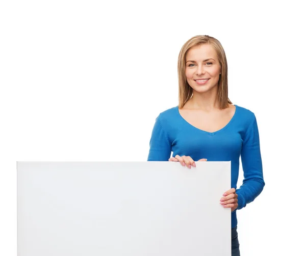 Mujer sonriente en suéter con pizarra blanca en blanco —  Fotos de Stock