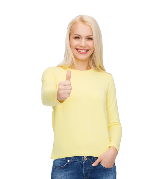 Smiling girl in casual clothes showing thumbs up — Stock Photo, Image