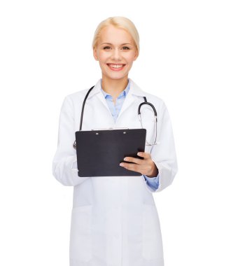 Smiling female doctor with clipboard clipart