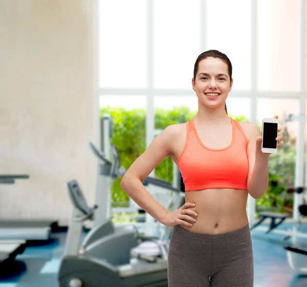 Mujer deportiva con smartphone — Foto de Stock