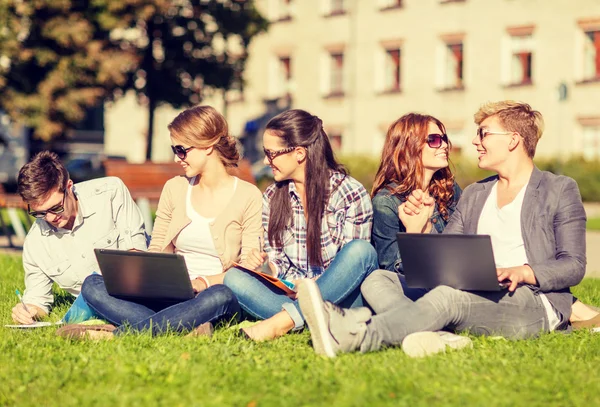 Students or teenagers with laptop computers — Stock Photo, Image