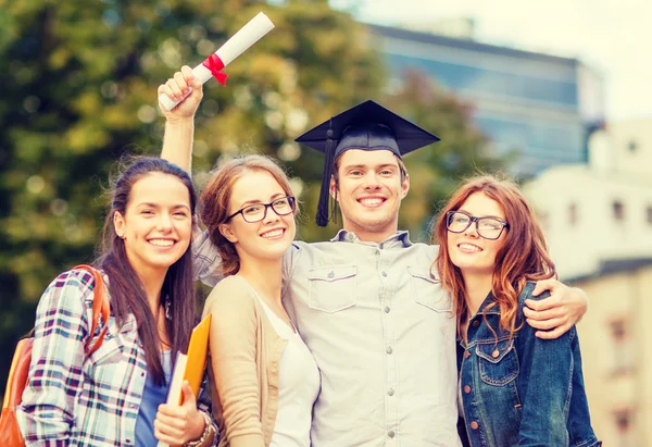 Students or teenagers with files and diploma — Stock Photo, Image