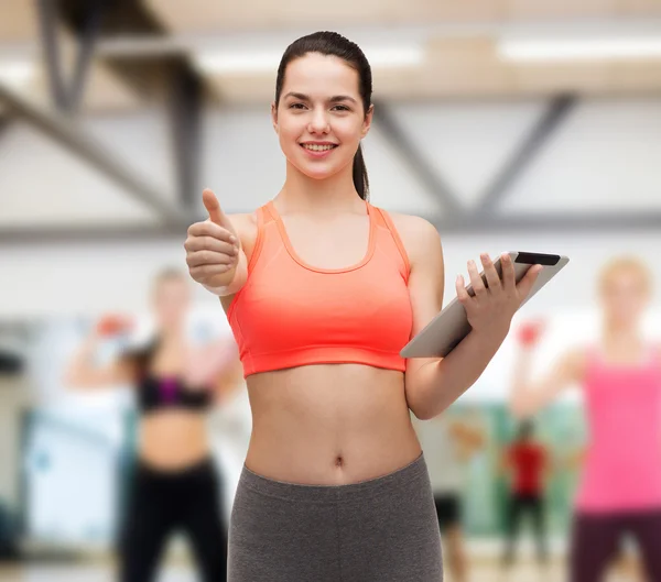 Sportliche Frau mit Tablet-PC — Stockfoto