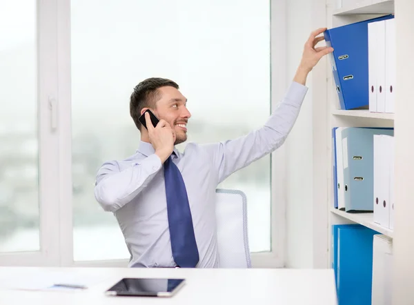 Businessman with smartphone and tablet pc — Stock Photo, Image