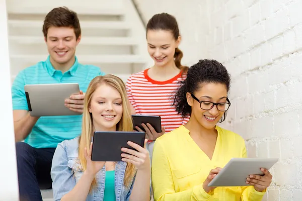 Smiling students with tablet pc computer — Stock Photo, Image