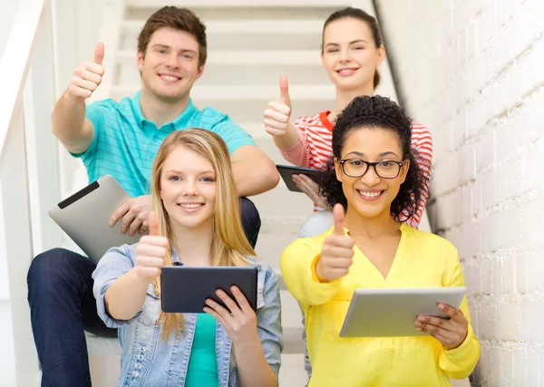 Smiling students with tablet pc computer — Stock Photo, Image