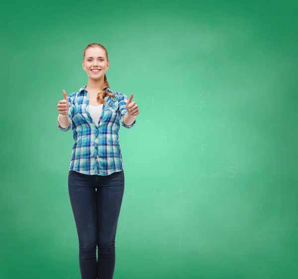 Young woman in casual clothes showing thumbs up — Stock Photo, Image