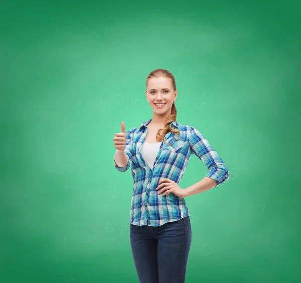 Young woman in casual clothes showing thumbs up — Stock Photo, Image