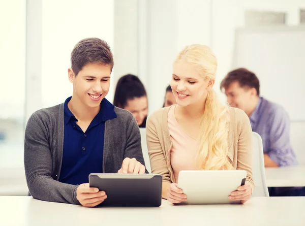 Students looking at tablet pc in lecture at school — Stock Photo, Image