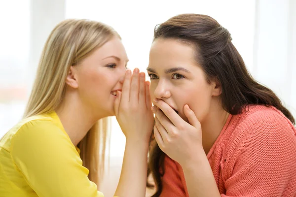 One girl telling another secret — Stock Photo, Image