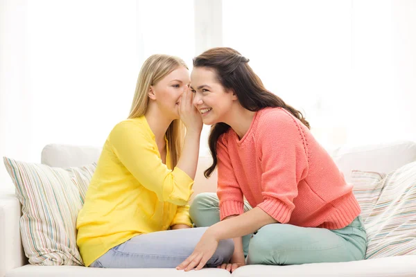 One girl telling another secret — Stock Photo, Image