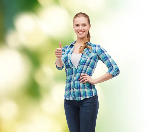 Young woman in casual clothes showing thumbs up — Stock Photo, Image