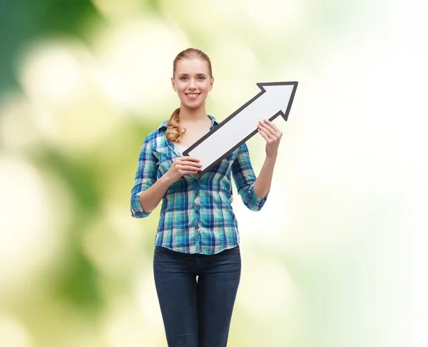 Smiling young woman with arrow poiting up — Stock Photo, Image