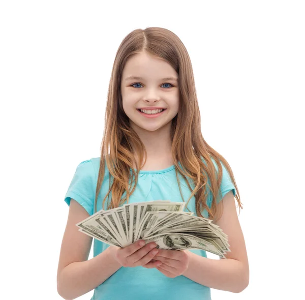 Dolar nakit para ile küçük kız gülümseyerek — Stok fotoğraf
