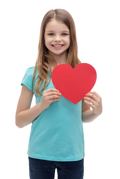 Smiling little girl with red heart Royalty Free Stock Photos