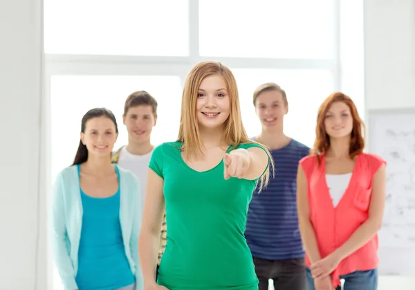 Students with teenager in front pointing at you — Stock Photo, Image