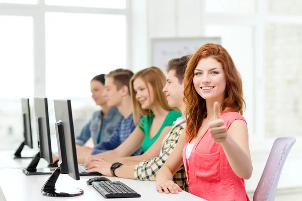 Female student with classmates in computer class — Stock Photo, Image