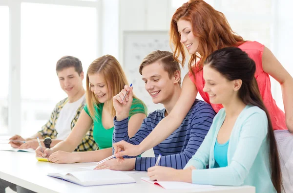 Students with textbooks and books at school — Stock Photo, Image