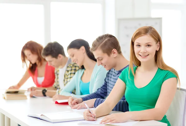 Students with textbooks and books at school Stock Image