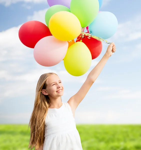 Happy girl with colorful balloons — Stock Photo, Image