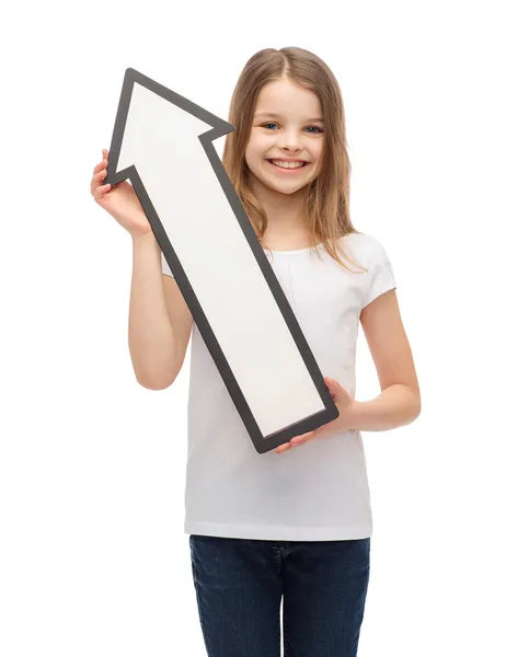 Sorrindo menina com seta em branco apontando para cima — Fotografia de Stock