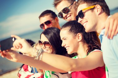 group of friends taking picture with smartphone clipart