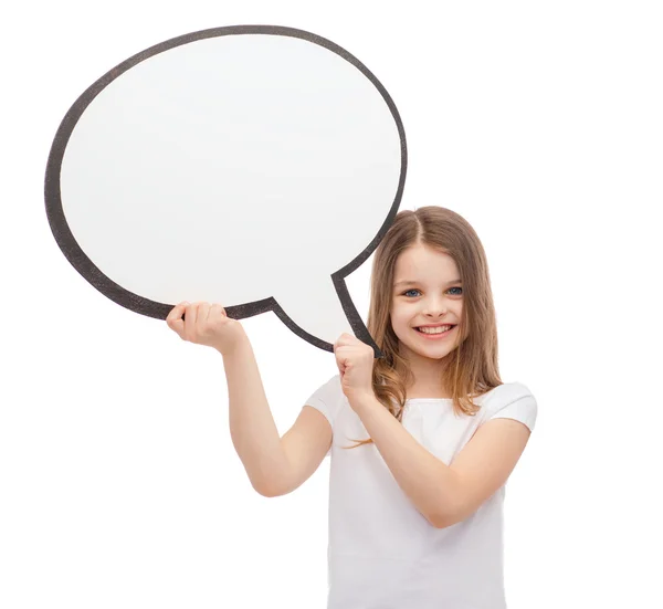 Smiling little girl with blank text bubble — Stock Photo, Image