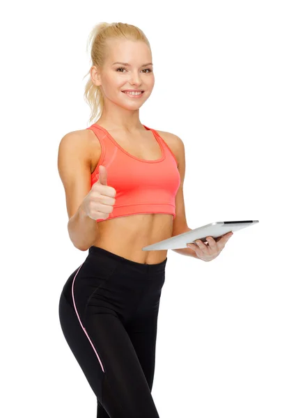 Glimlachend sportieve vrouw met tablet pc-computer — Stockfoto