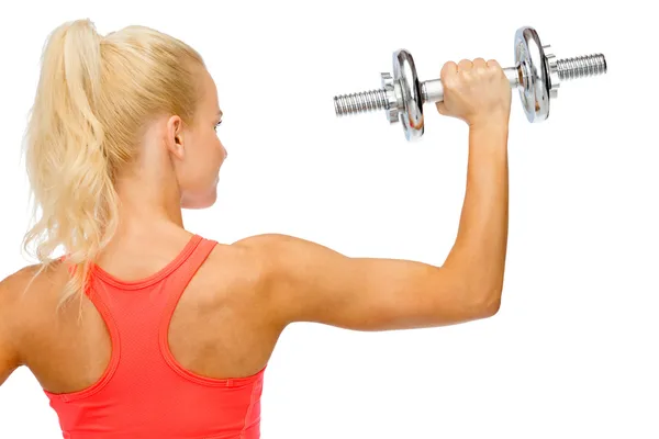 Sporty woman with heavy steel dumbbell from back — Stock Photo, Image