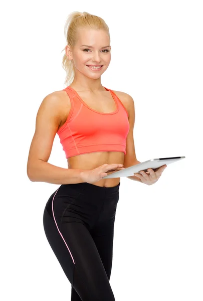 Mujer deportiva sonriente con la computadora de la tableta PC Imágenes de stock libres de derechos