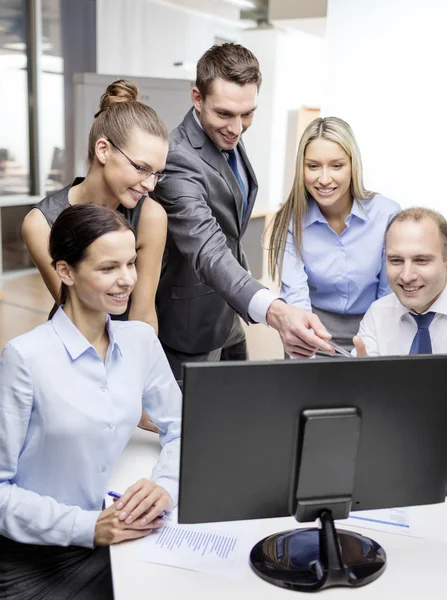 Business team with monitor having discussion — Stock Photo, Image