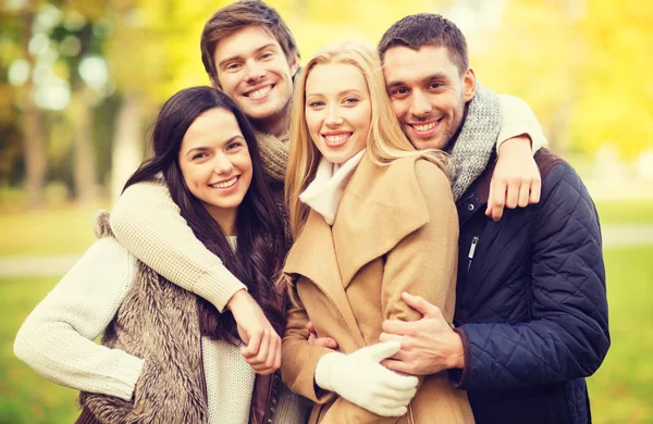 Group of friends having fun in autumn park — Stock Photo, Image