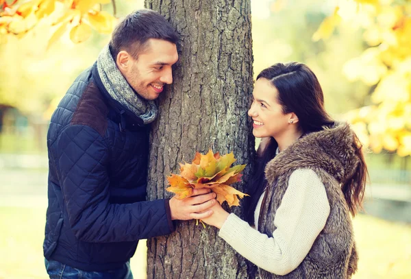 Romantic couple playing in the autumn park — Stock Photo, Image