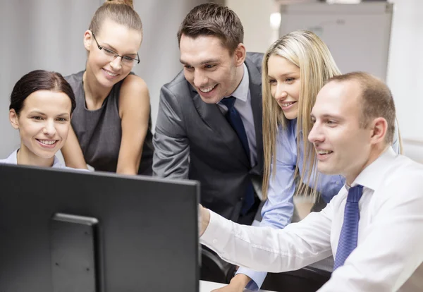 Business team with monitor having discussion — Stock Photo, Image