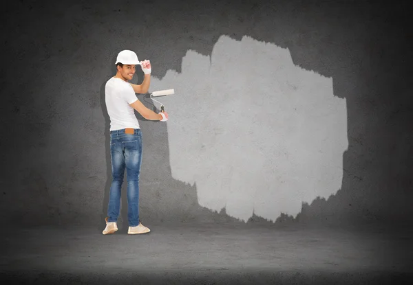 Handsome painter in helmet from the back — Stock Photo, Image