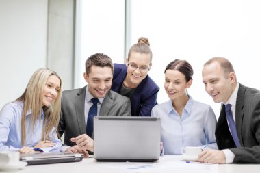 business team with laptop having discussion clipart