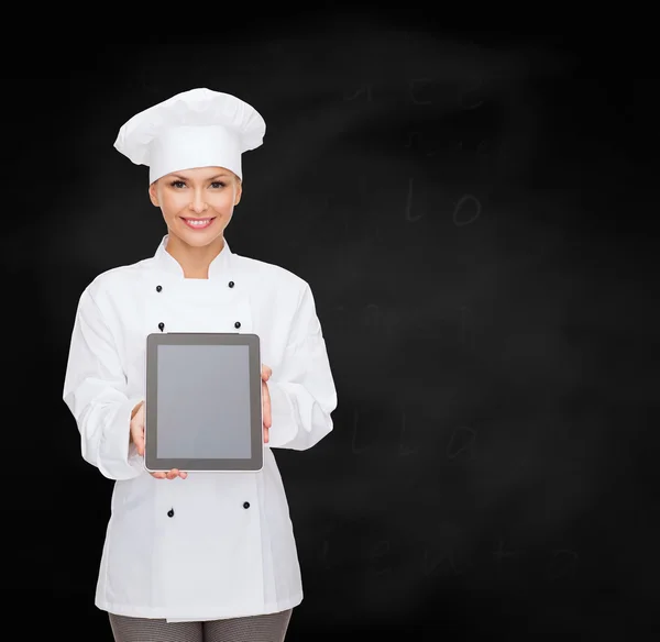 Uśmiechnięta kobieta kucharz z tabliczka pc pusty ekran — Zdjęcie stockowe