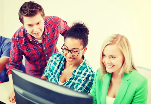 Students with computer studying at school — Stock Photo, Image