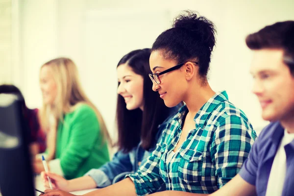 African student with computer studying at school Royalty Free Stock Photos