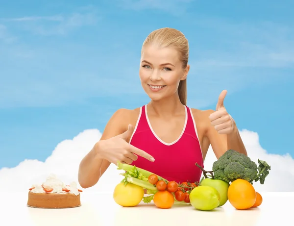 Woman wijzend op gezonde voeding — Stockfoto