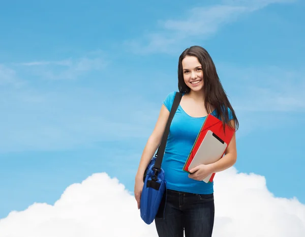 Studente sorridente con borsa, cartelle e tablet pc — Foto Stock