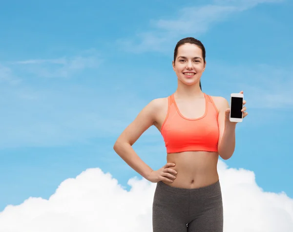 Sportliche Frau mit Smartphone — Stockfoto